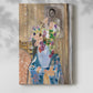 Canvas art print of a layered composition with floral arrangement and background image with a soft shadow on a white background.