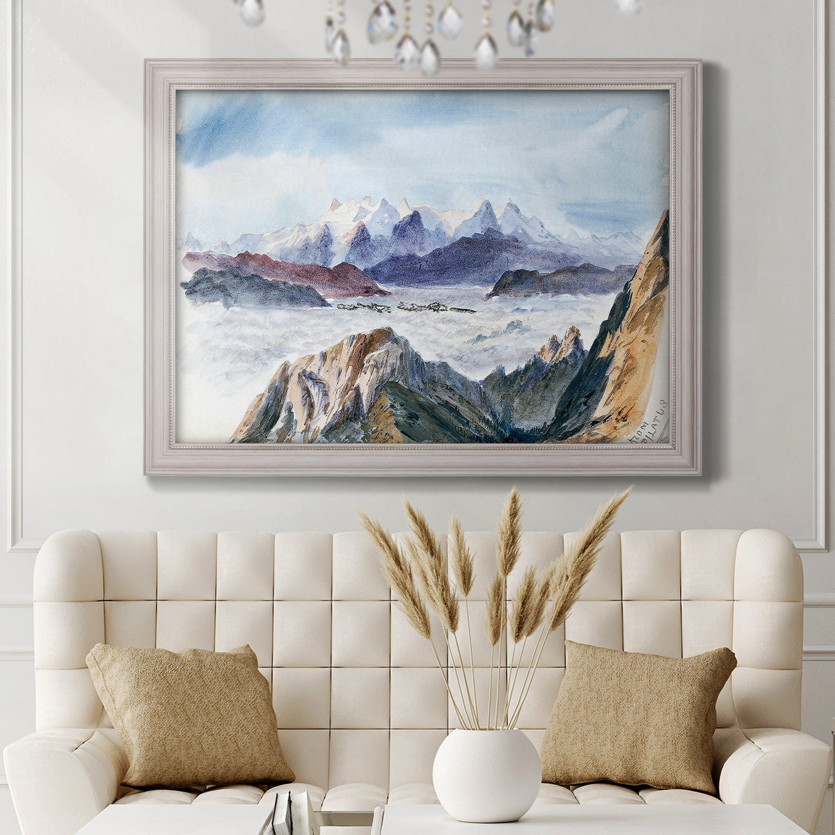 Impressionist alpine mountain landscape by John Singer Sargent in an ornate weathered white frame displayed in a neutral-toned interior setting.