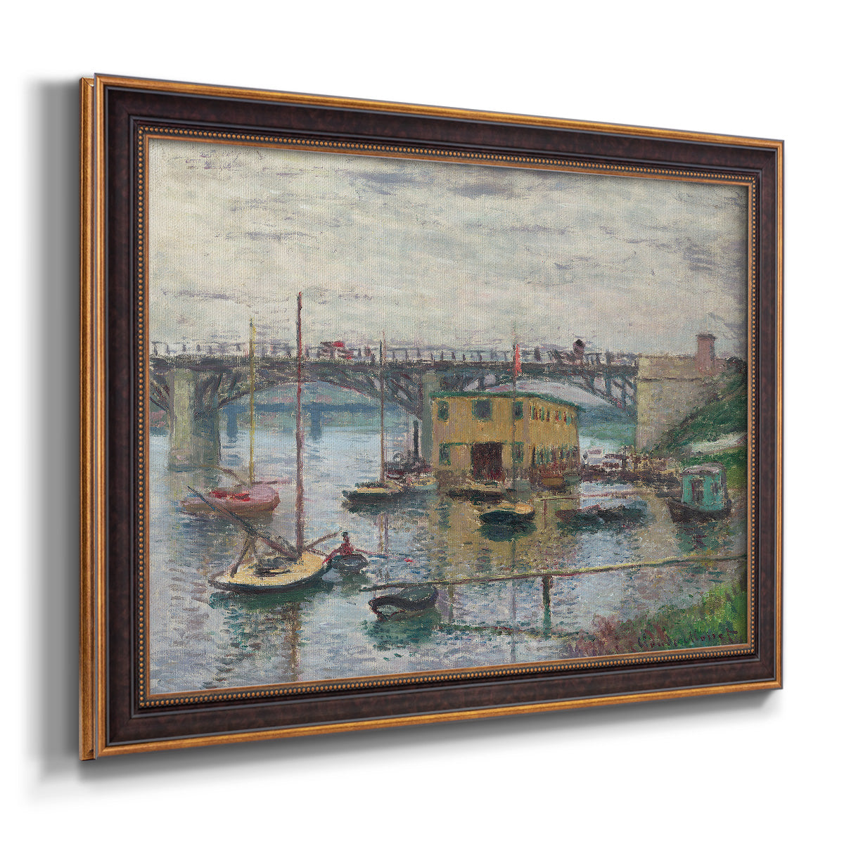 Impressionist river bridge scene on an overcast day by Claude Monet printed on canvas in an ornate bronzed mahogany wood frame.