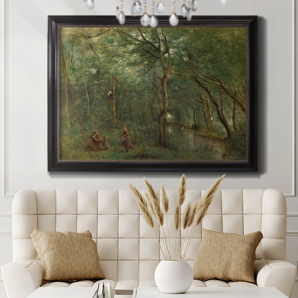 Traditional rural landscape scene with figures by Jean-Baptiste-Camille Corot in an ornate black frame with gilded inner detail displayed in a neutral-toned interior setting.