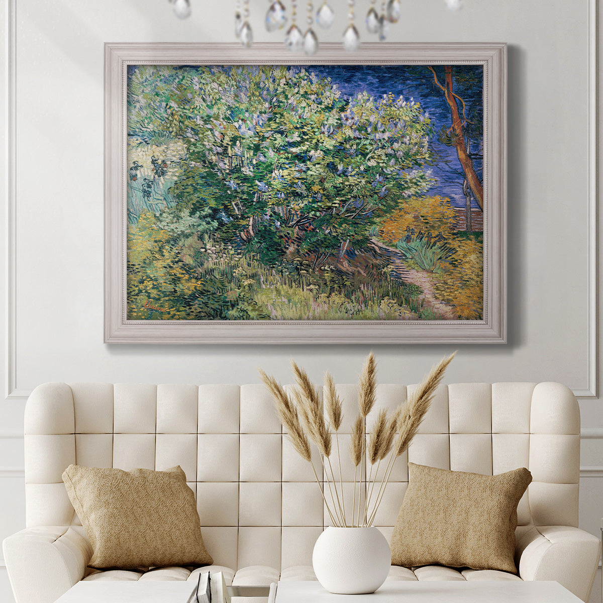 Impressionist lilac flower painting by Vincent van Gogh in an ornate weathered white frame displayed in a neutral-toned interior setting.