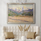 Impressionist valley landscape in southern France by Claude Monet in an ornate champagne frame displayed in a neutral-toned interior setting.