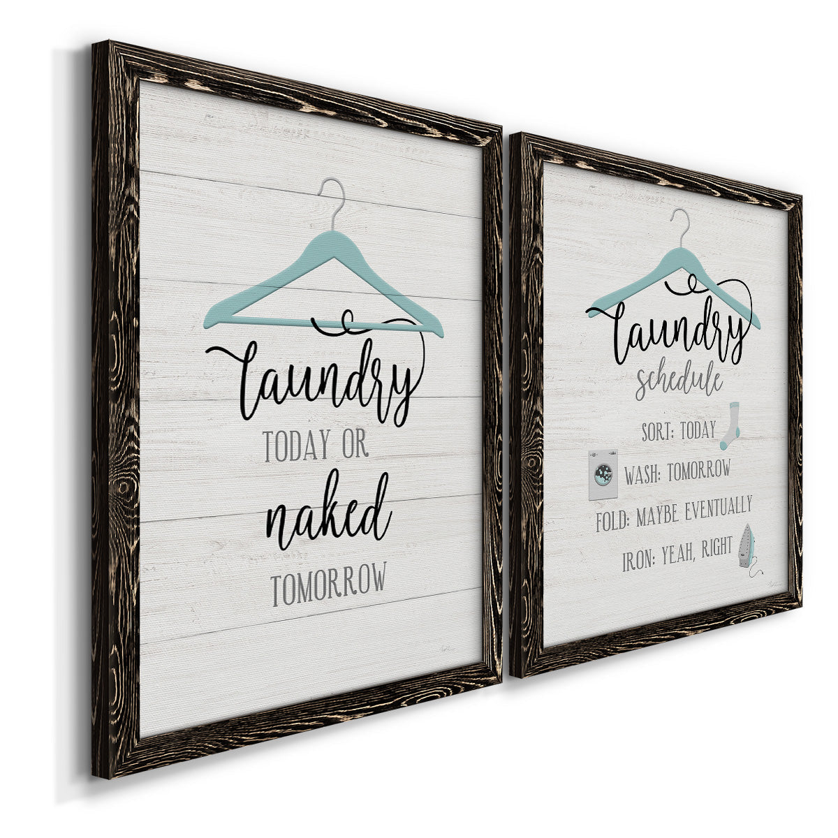 Angled view of a set of two black barnwood framed canvas prints featuring two rustic typographic wall art featuring humorous laundry-room sayings and clothing icons.