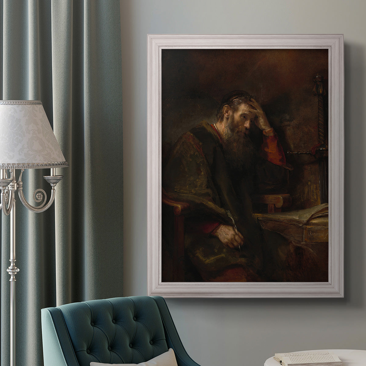 Classical religious portrait of Paul the Apostle by Rembrandt van Rijn in an ornate weathered white frame displayed in a neutral interior setting.