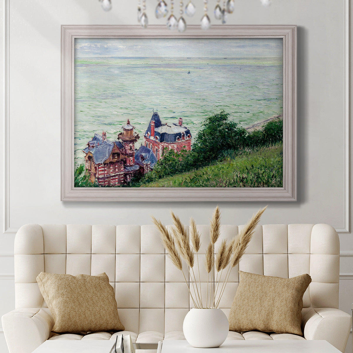 Impressionist coastal villas landscape by Gustave Caillebotte in an ornate weathered white frame displayed in a neutral-toned interior setting.
