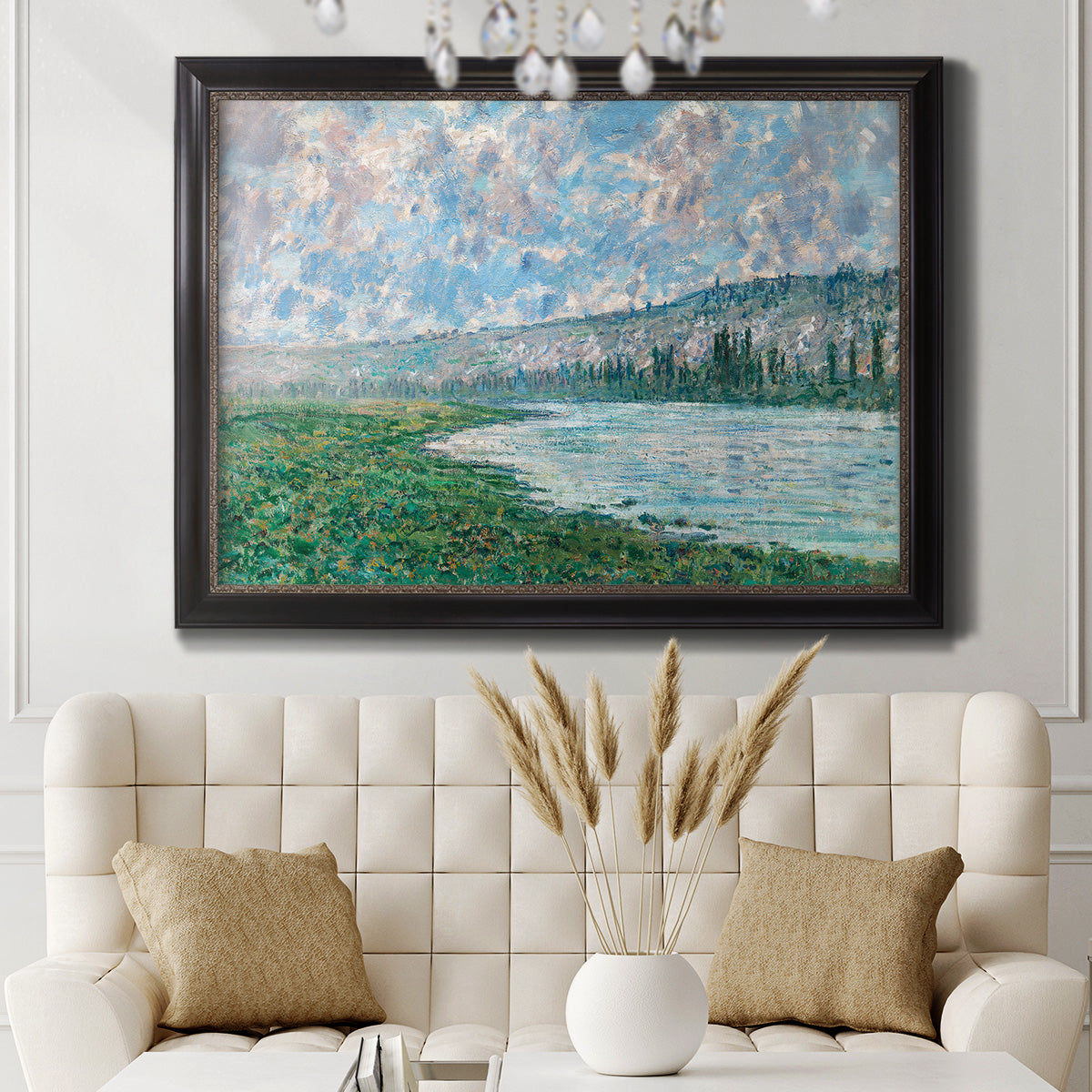 Impressionist river landscape at Vétheuil by Claude Monet in an ornate black frame with gilded inner detail displayed in a neutral-toned interior setting.