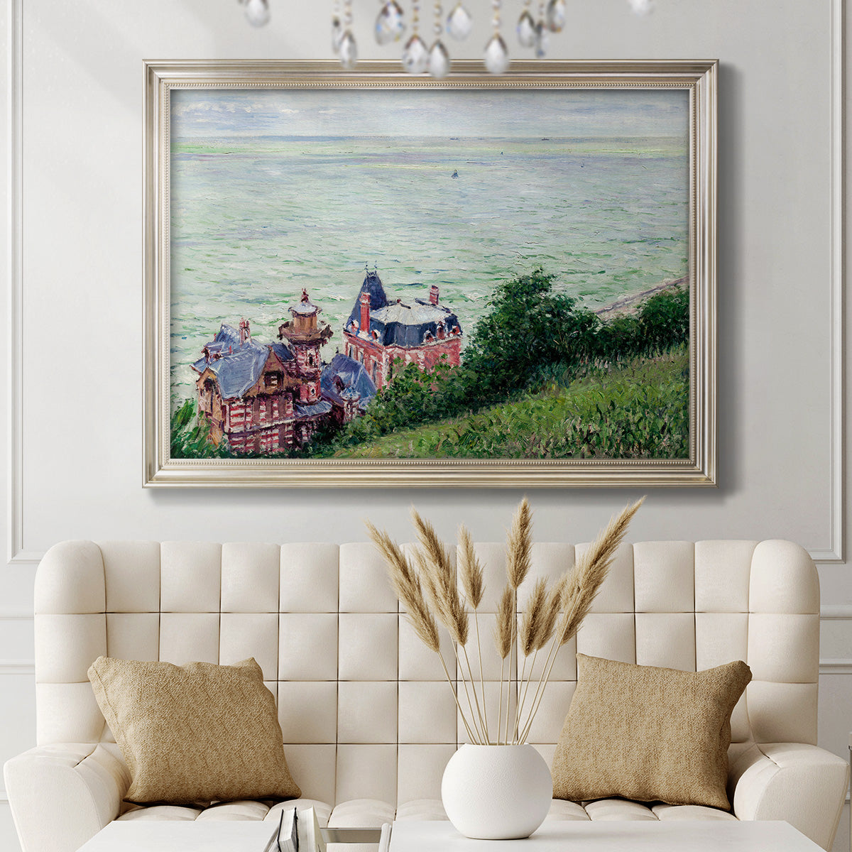 Impressionist coastal villas landscape by Gustave Caillebotte in an ornate champagne frame displayed in a neutral-toned interior setting.