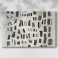 Modern abstract art composition featuring contrasting black and white shapes on canvas