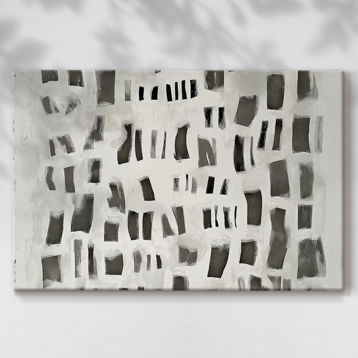 Modern abstract art composition featuring contrasting black and white shapes on canvas