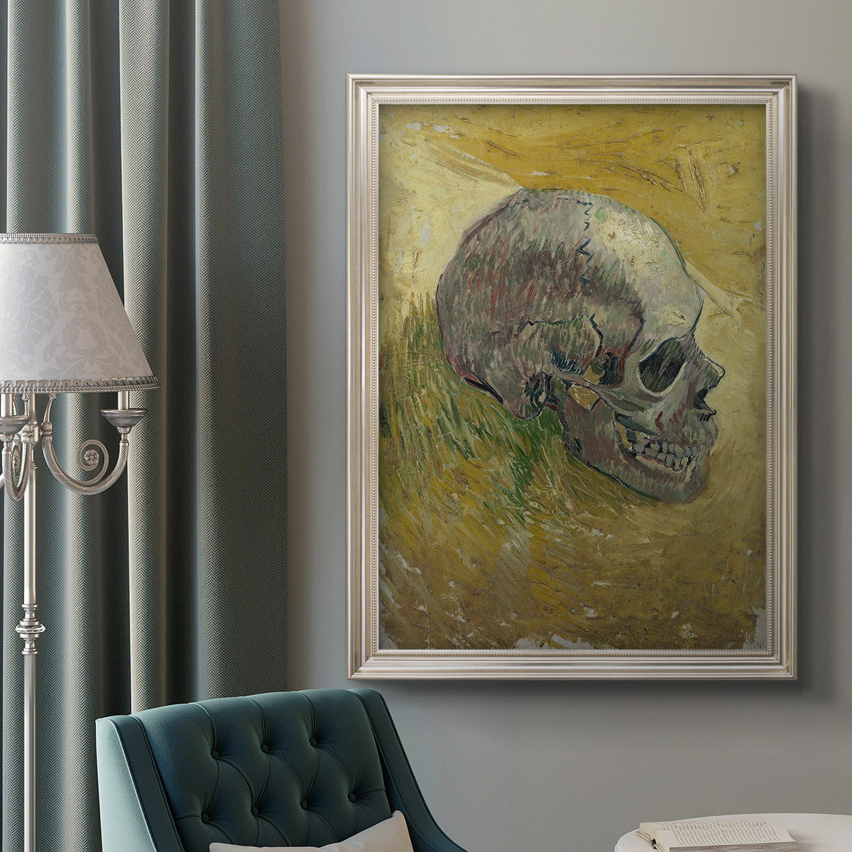 Profile skull study artwork by Vincent van Gogh in an ornate champagne frame displayed in a neutral interior setting.