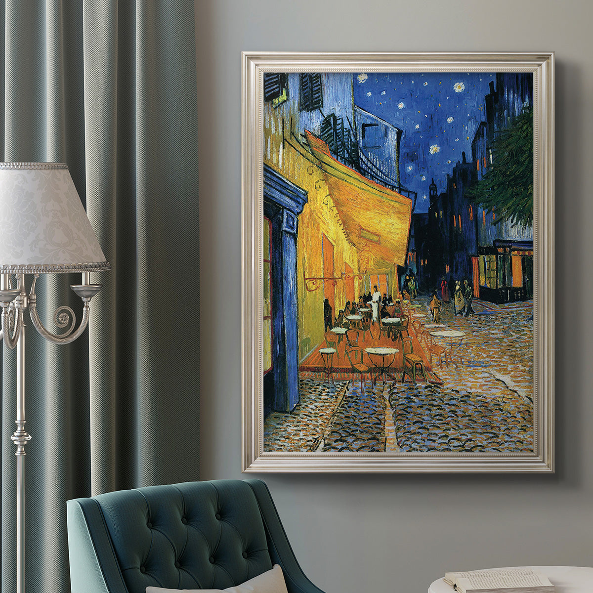 Impressionist night café street scene by Vincent van Gogh in an ornate champagne frame displayed in a neutral interior setting.