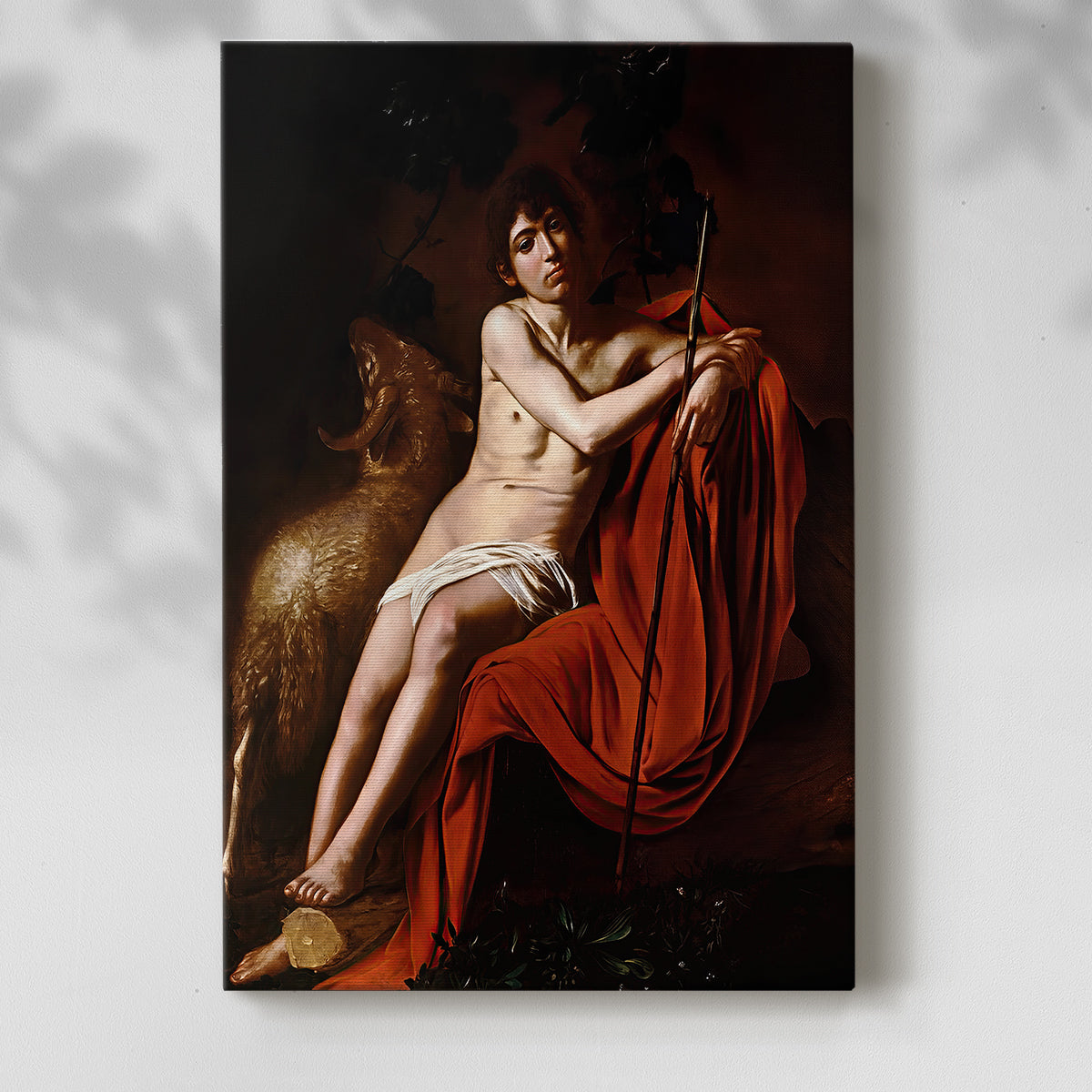 Canvas art print of a solitary figure seated in shadow with soft highlights with a soft shadow on a white background.