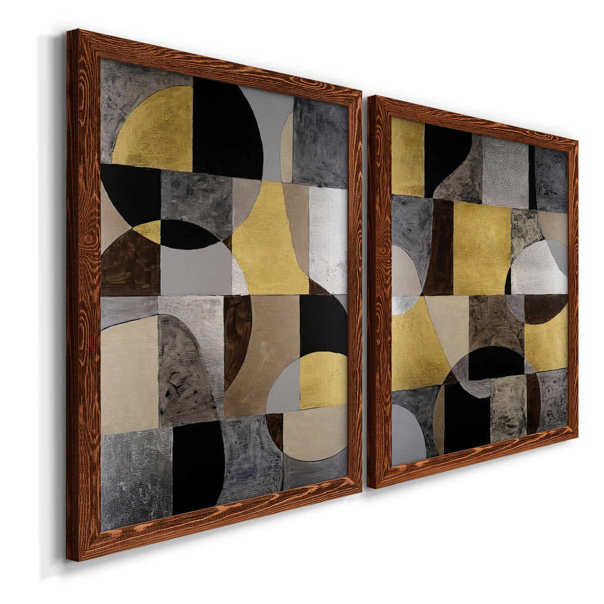 Angled view of a set of two maple barnwood framed canvas prints featuring two structured modern abstracts featuring interlocking black gray cream and gold geometric sections.