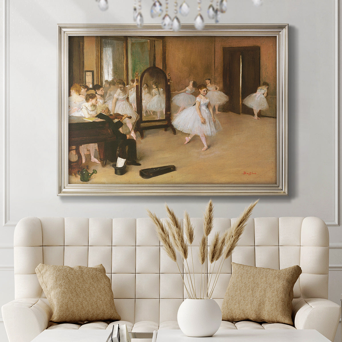 Impressionist dance class interior scene by Edgar Degas in an ornate champagne frame displayed in a neutral-toned interior setting.