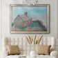 Impressionist coastal building landscape by Claude Monet in an ornate champagne frame displayed in a neutral-toned interior setting.