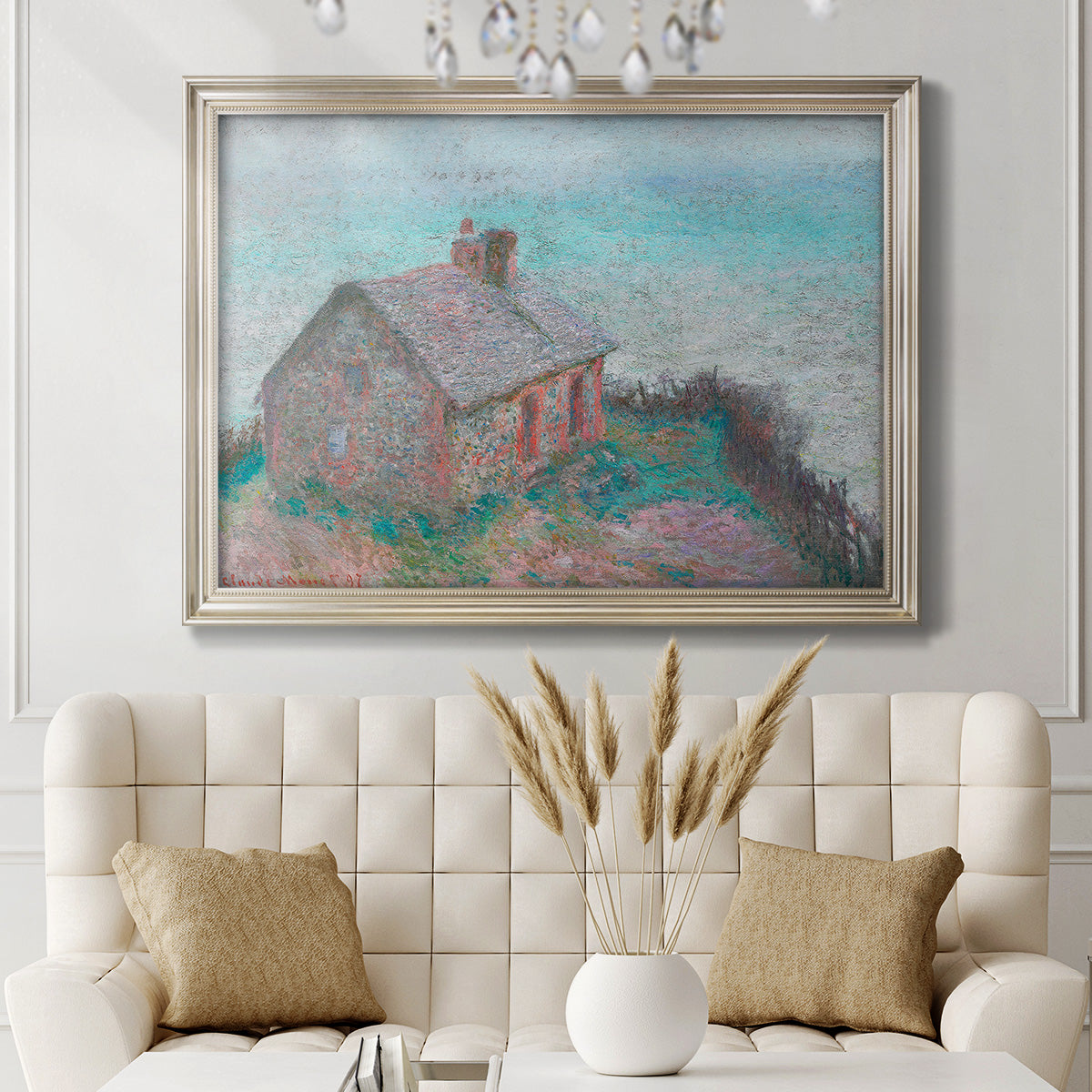 Impressionist coastal building landscape by Claude Monet in an ornate champagne frame displayed in a neutral-toned interior setting.