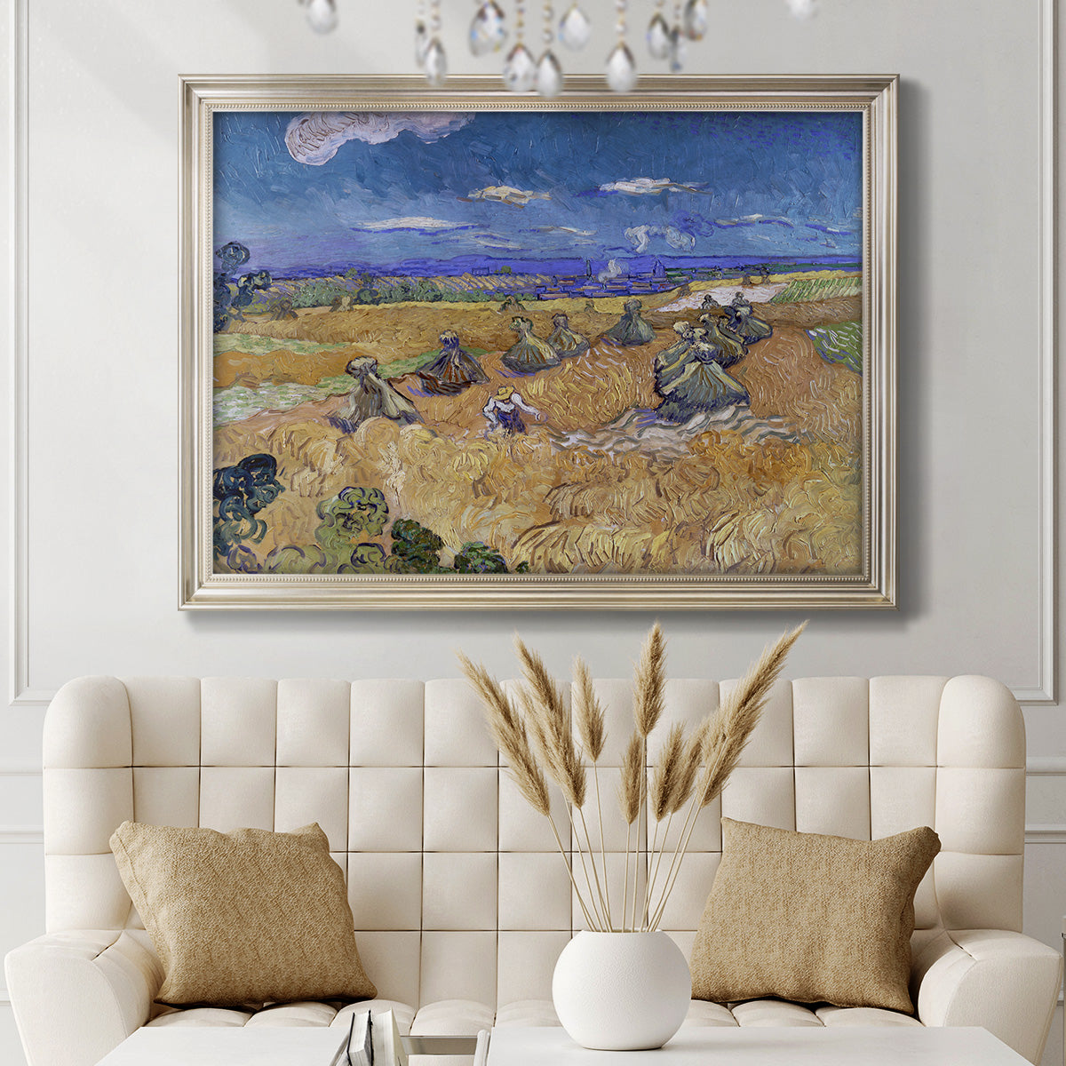 Impressionist wheat harvest scene by Vincent van Gogh in an ornate champagne frame displayed in a neutral-toned interior setting.
