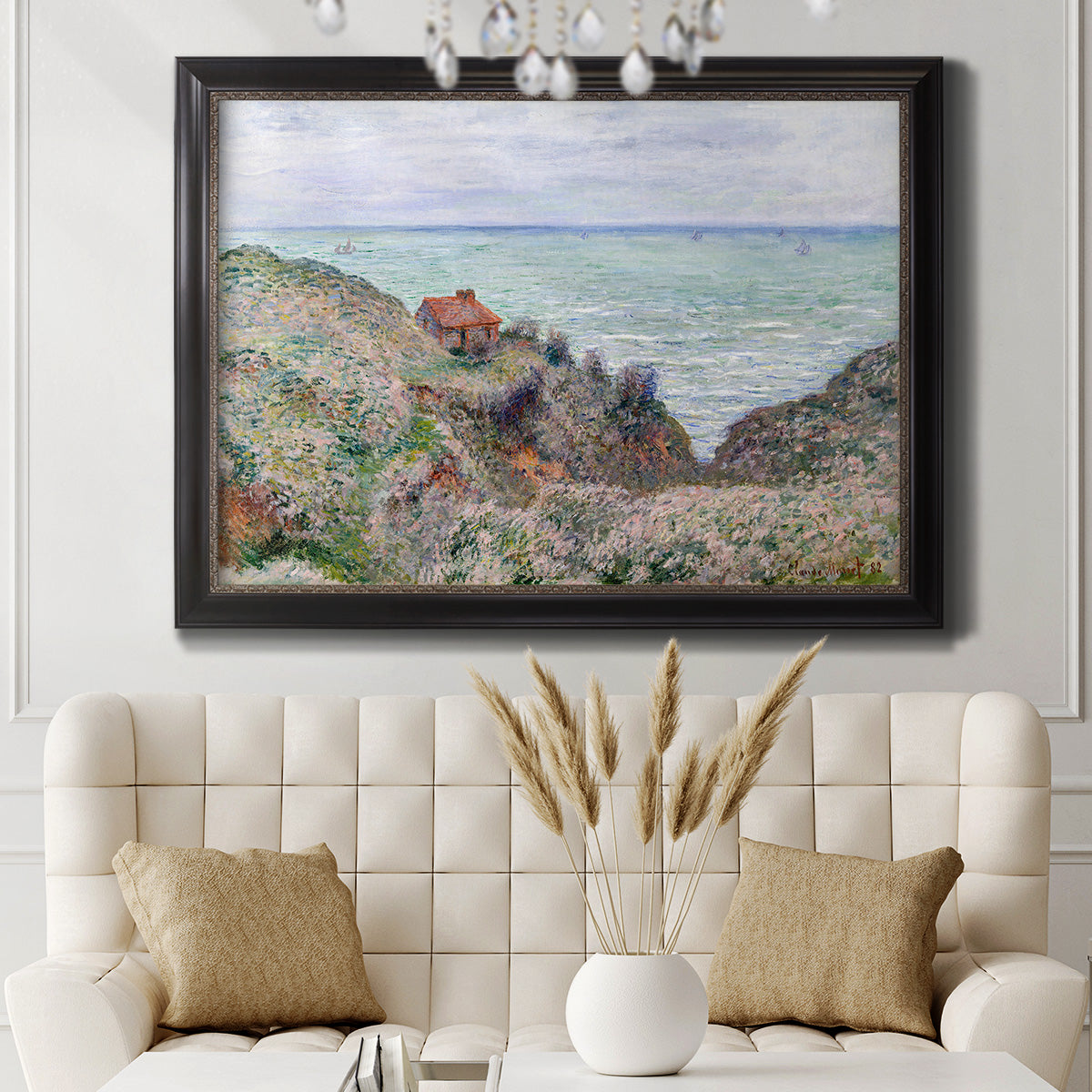 Impressionist coastal watch cabin scene by Claude Monet in an ornate black frame with gilded inner detail displayed in a neutral-toned interior setting.