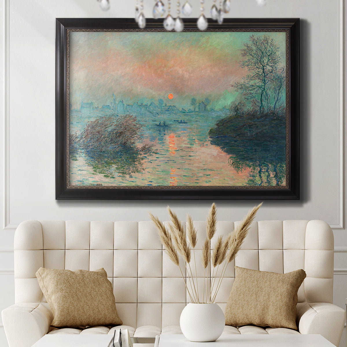 Impressionist winter river sunset scene by Claude Monet in an ornate black frame with gilded inner detail displayed in a neutral-toned interior setting.