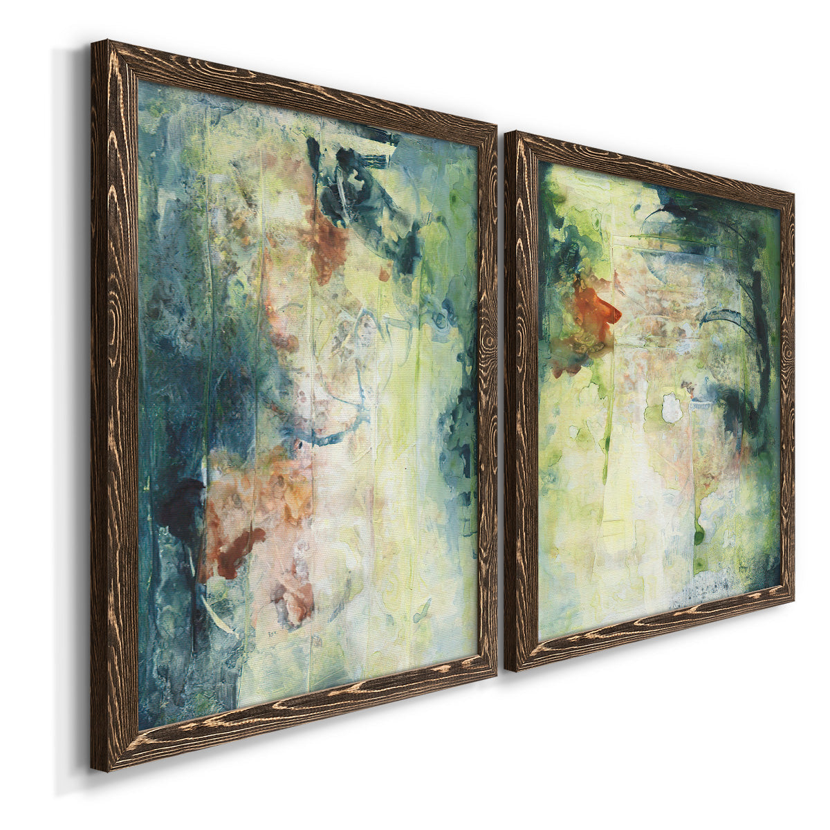 Angled view of a set of two walnut barnwood framed canvas prints featuring two nature-inspired mixed-media abstracts featuring layered blue green cream and charcoal textures.