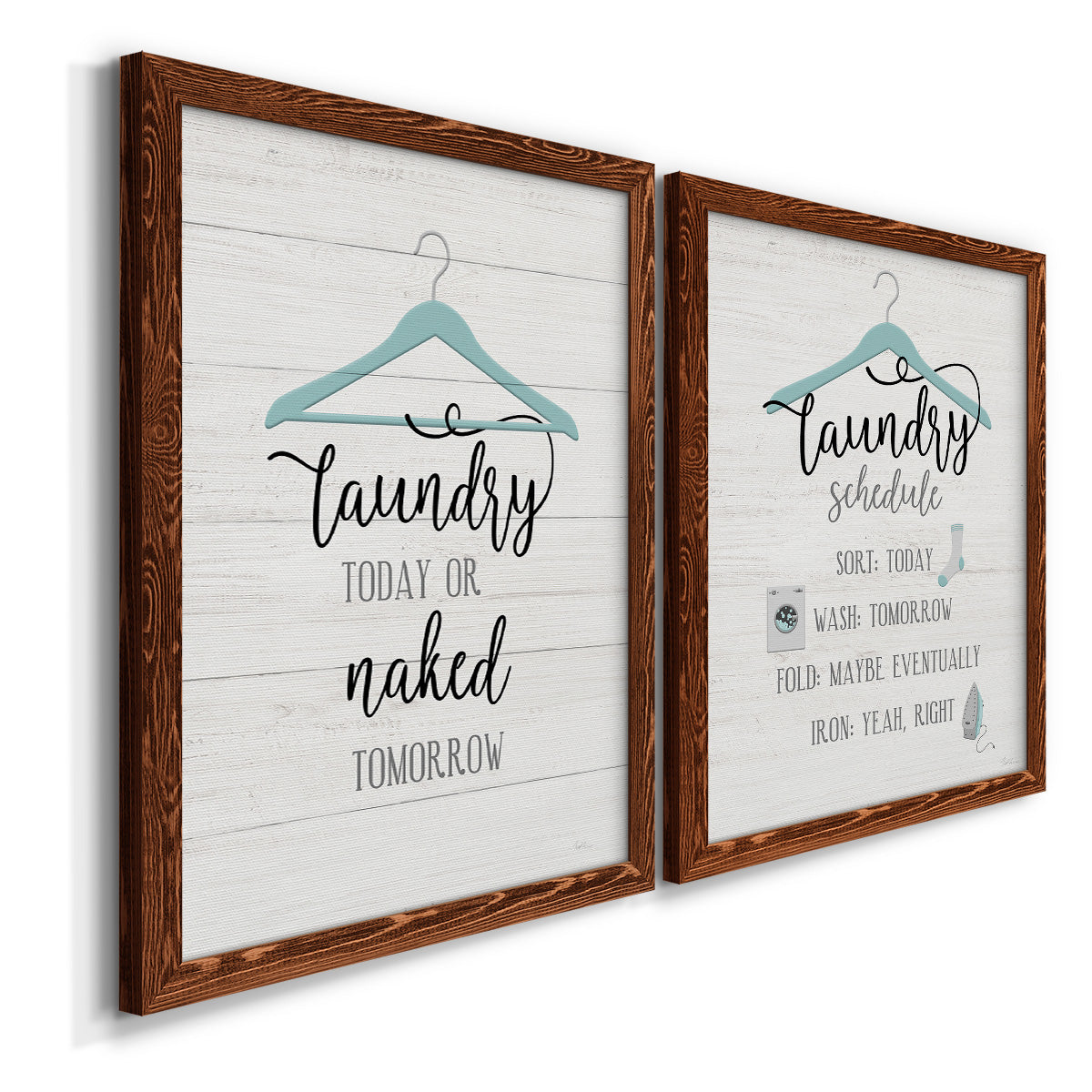 Angled view of a set of two maple barnwood framed canvas prints featuring two rustic typographic wall art featuring humorous laundry-room sayings and clothing icons.