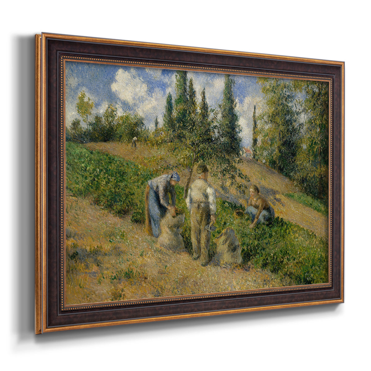 Impressionist countryside harvest scene by Camille Pissarro printed on canvas in an ornate bronzed mahogany wood frame.