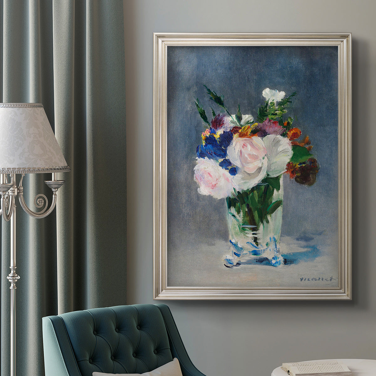 Impressionist floral still life painting by Claude Monet in an ornate champagne frame displayed in a neutral interior setting.