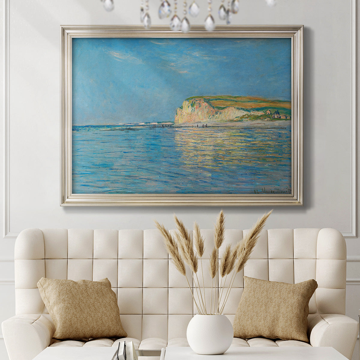 Impressionist coastal low-tide seascape at Pourville by Claude Monet in an ornate champagne frame displayed in a neutral-toned interior setting.