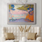 Pointillist coastal seascape by Paul Signac in an ornate weathered white frame displayed in a neutral-toned interior setting.