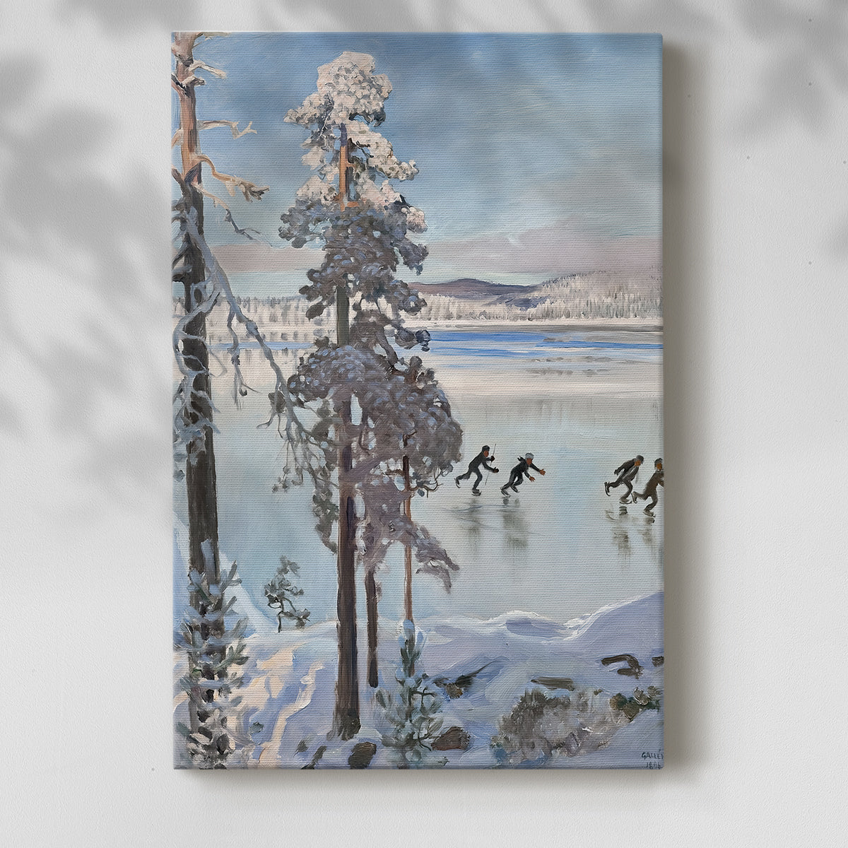 Canvas art print of a peaceful winter landscape with skaters on ice beside a forest shoreline with a soft shadow on a white background.
