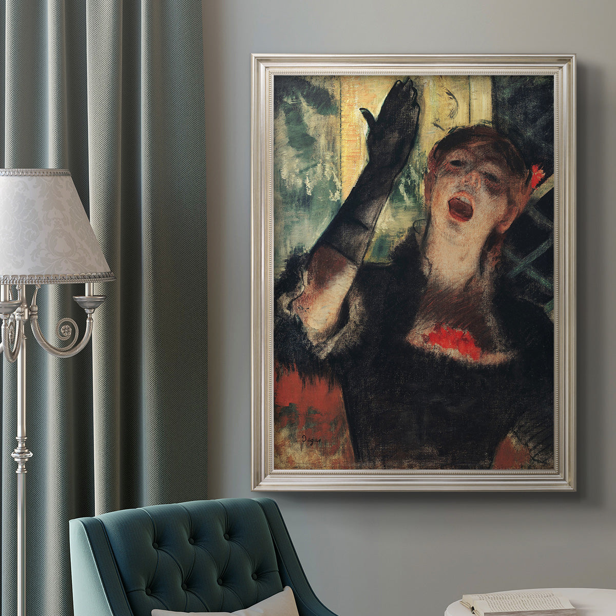 Impressionist portrait of a café singer by Edgar Degas in an ornate champagne frame displayed in a neutral interior setting.