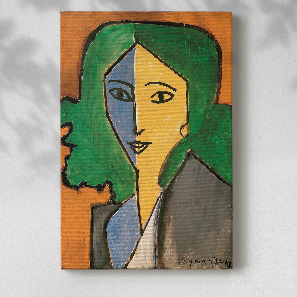 Canvas art print of a stylized face with geometric shapes and vivid tones with a soft shadow on a white background.