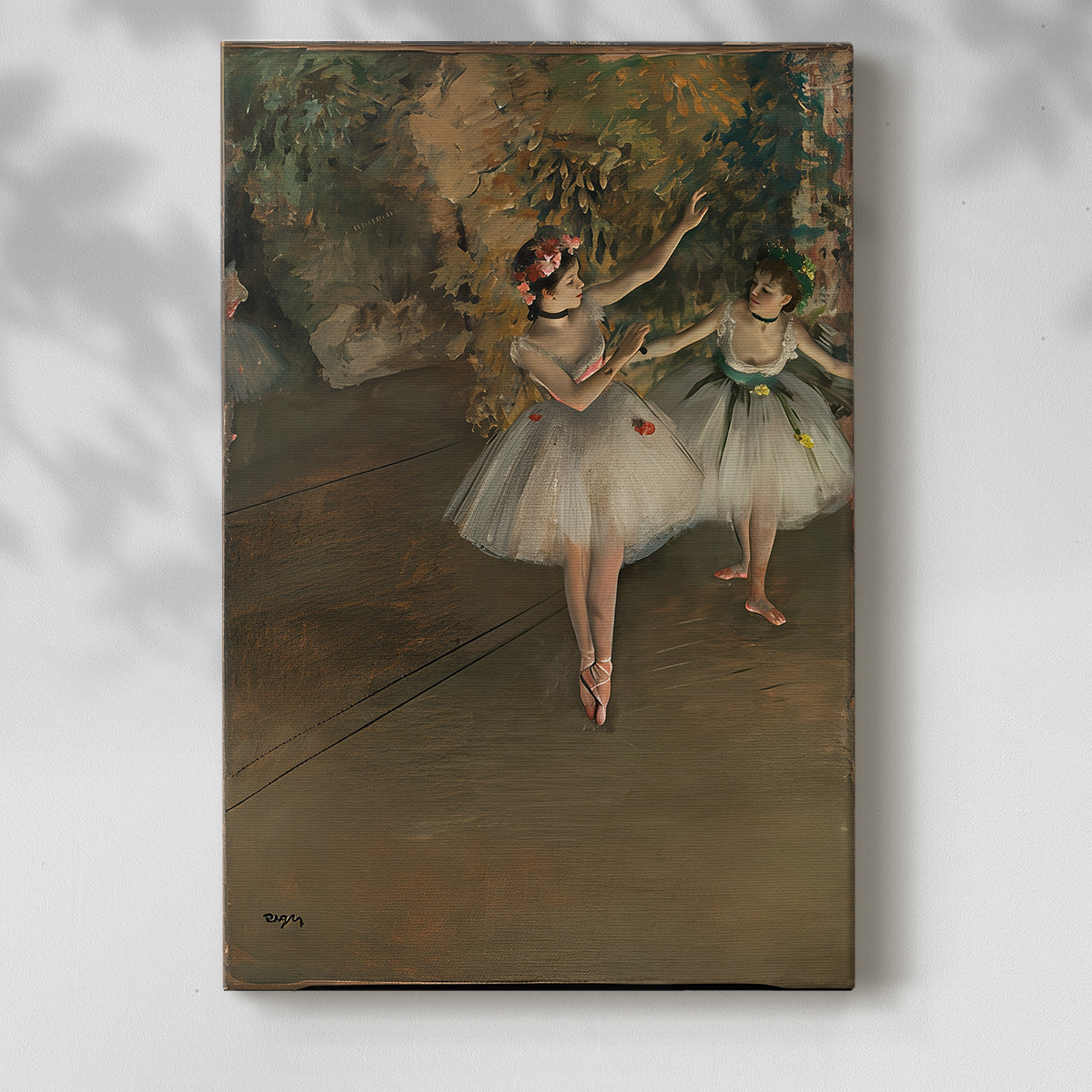 Canvas art print of a theatrical moment with dancers under warm stage lighting with a soft shadow on a white background.