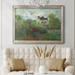 Impressionist garden landscape at Argenteuil by Claude Monet in an ornate champagne frame displayed in a neutral-toned interior setting.