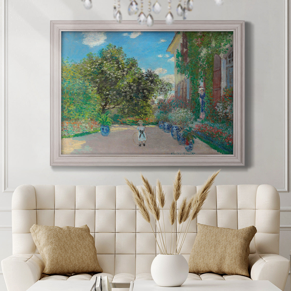 Impressionist residential landscape at Argenteuil by Claude Monet in an ornate weathered white frame displayed in a neutral-toned interior setting.