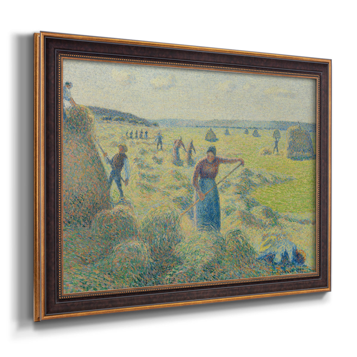 Impressionist rural hay harvest landscape by Camille Pissarro printed on canvas in an ornate bronzed mahogany wood frame.