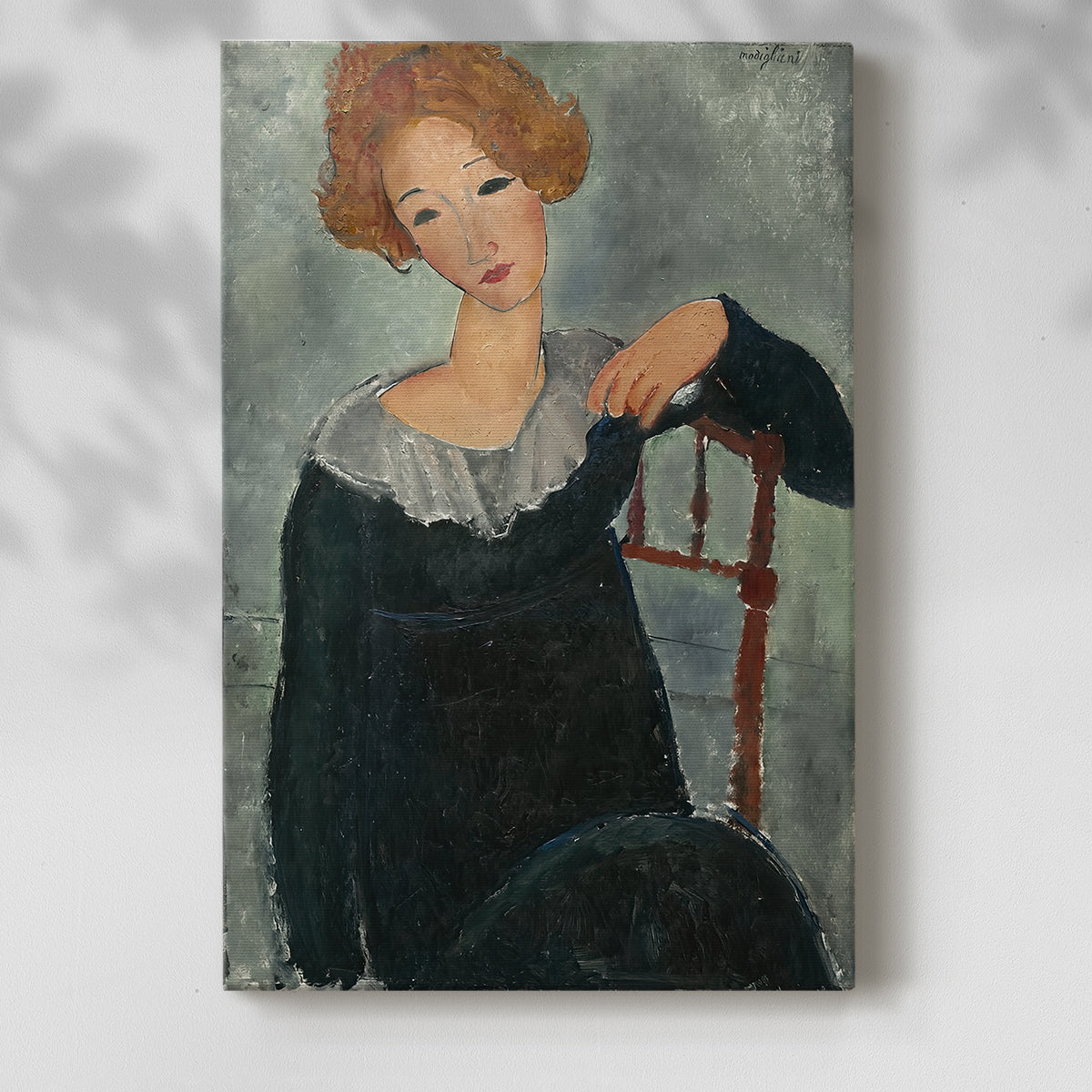 Canvas art print of a stylized portrait with simplified facial features and warm tones with a soft shadow on a white background.
