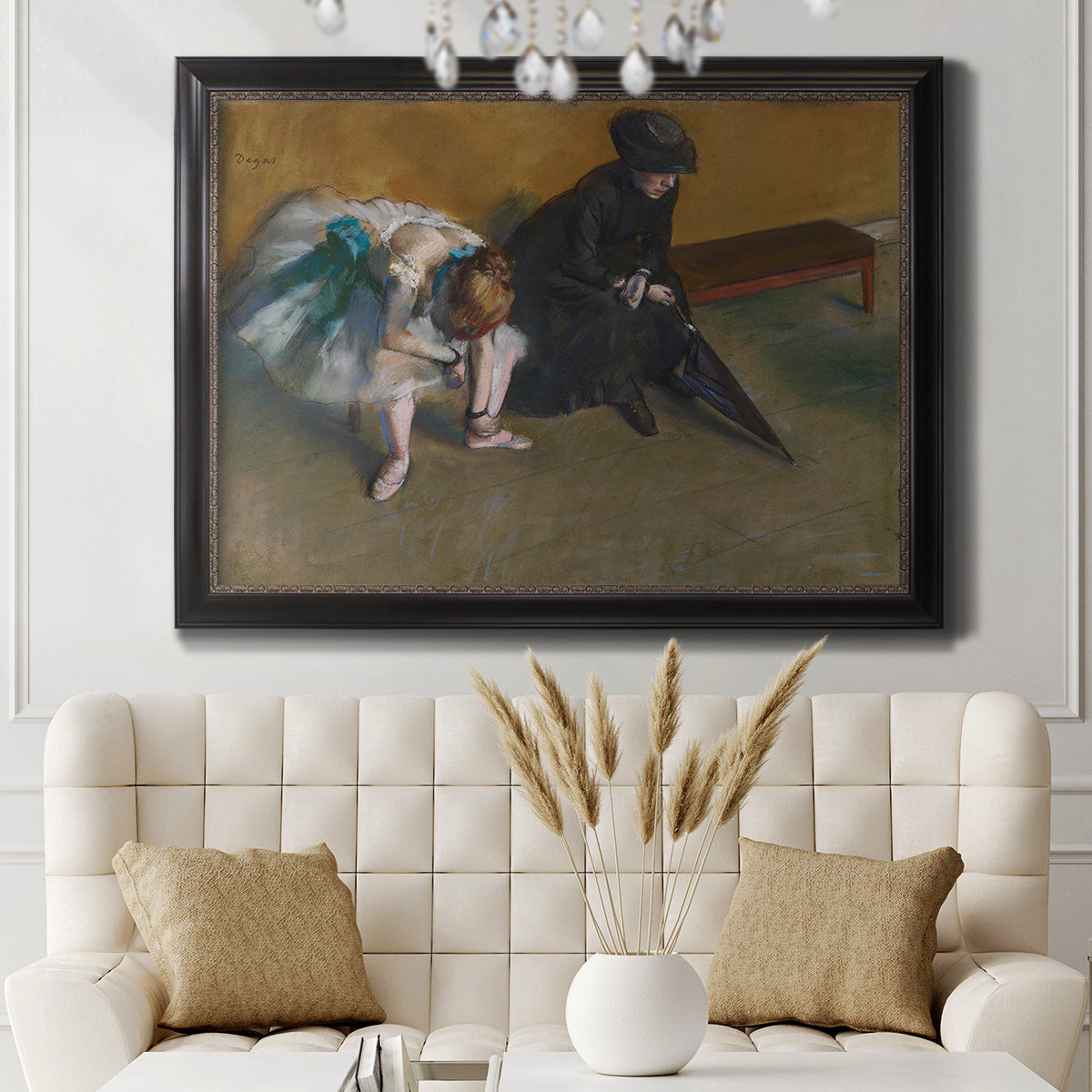Impressionist portrait of a seated woman by Edgar Degas in an ornate black frame with gilded inner detail displayed in a neutral-toned interior setting.