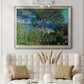 Impressionist Mediterranean coastal landscape by Claude Monet in an ornate champagne frame displayed in a neutral-toned interior setting.