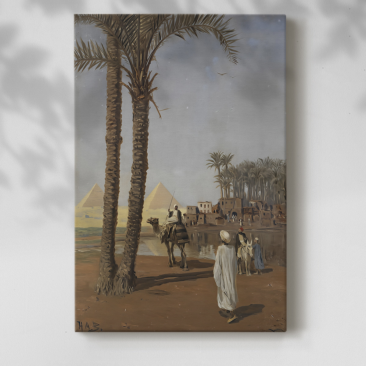 Canvas art print of a distant view of pyramids with figures in a sandy setting with a soft shadow on a white background.