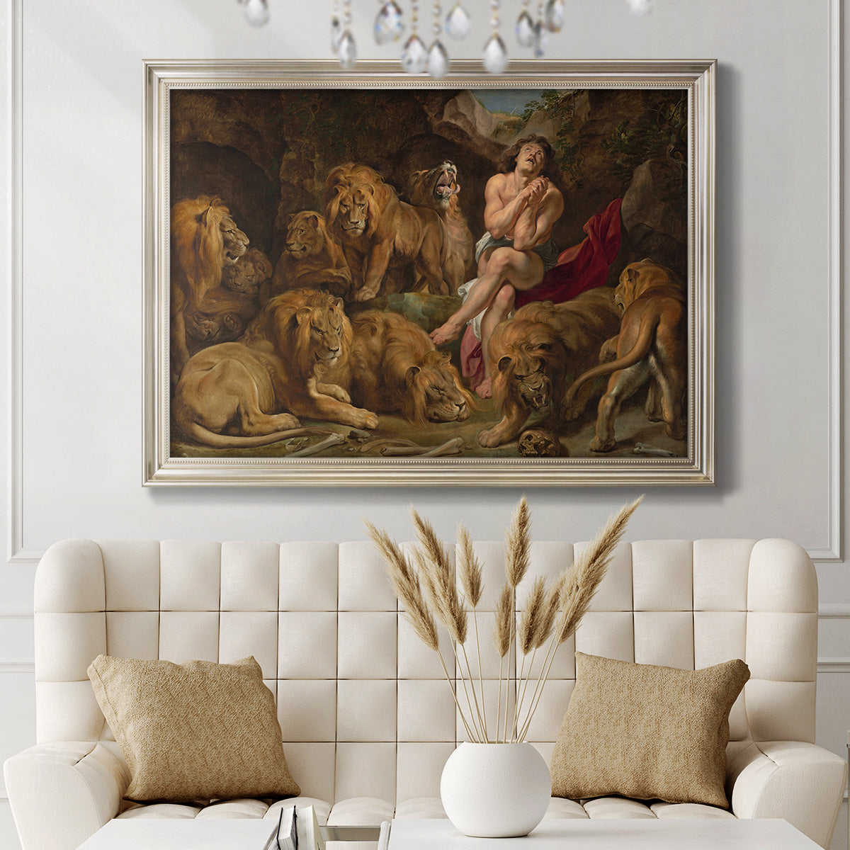 Dramatic biblical painting of Daniel with lions by Peter Paul Rubens in an ornate champagne frame displayed in a neutral-toned interior setting.