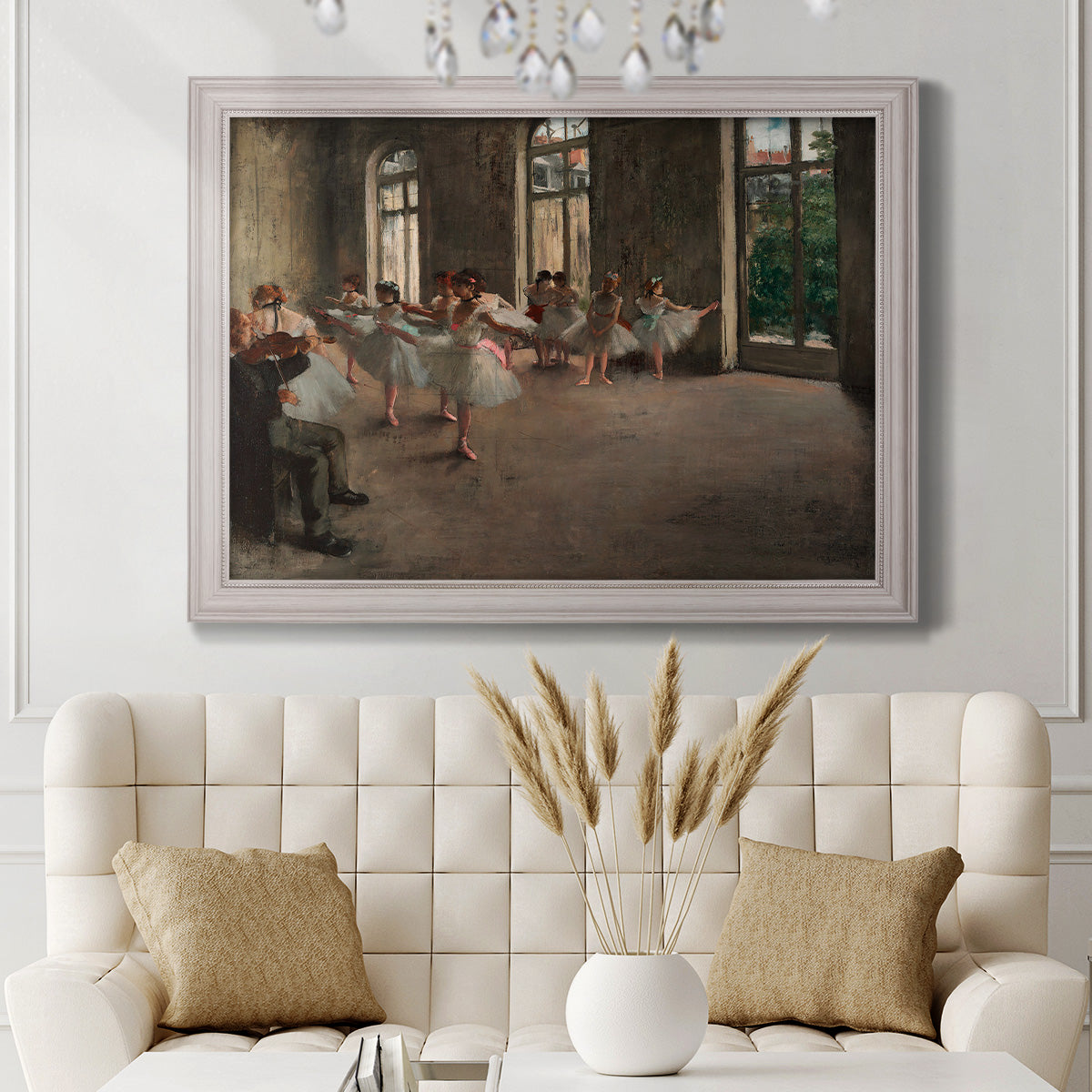 Early impressionist ballet rehearsal painting by Edgar Degas in an ornate weathered white frame displayed in a neutral-toned interior setting.