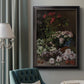 Early impressionist floral painting by Claude Monet in an ornate black frame with gilded inner detail displayed in a neutral interior setting.