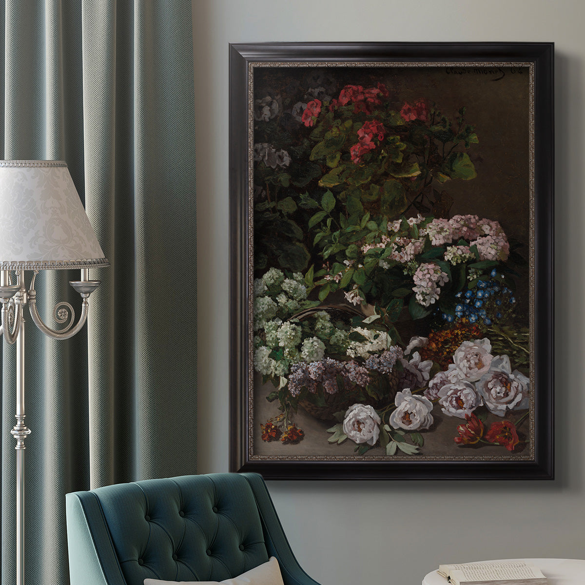 Early impressionist floral painting by Claude Monet in an ornate black frame with gilded inner detail displayed in a neutral interior setting.