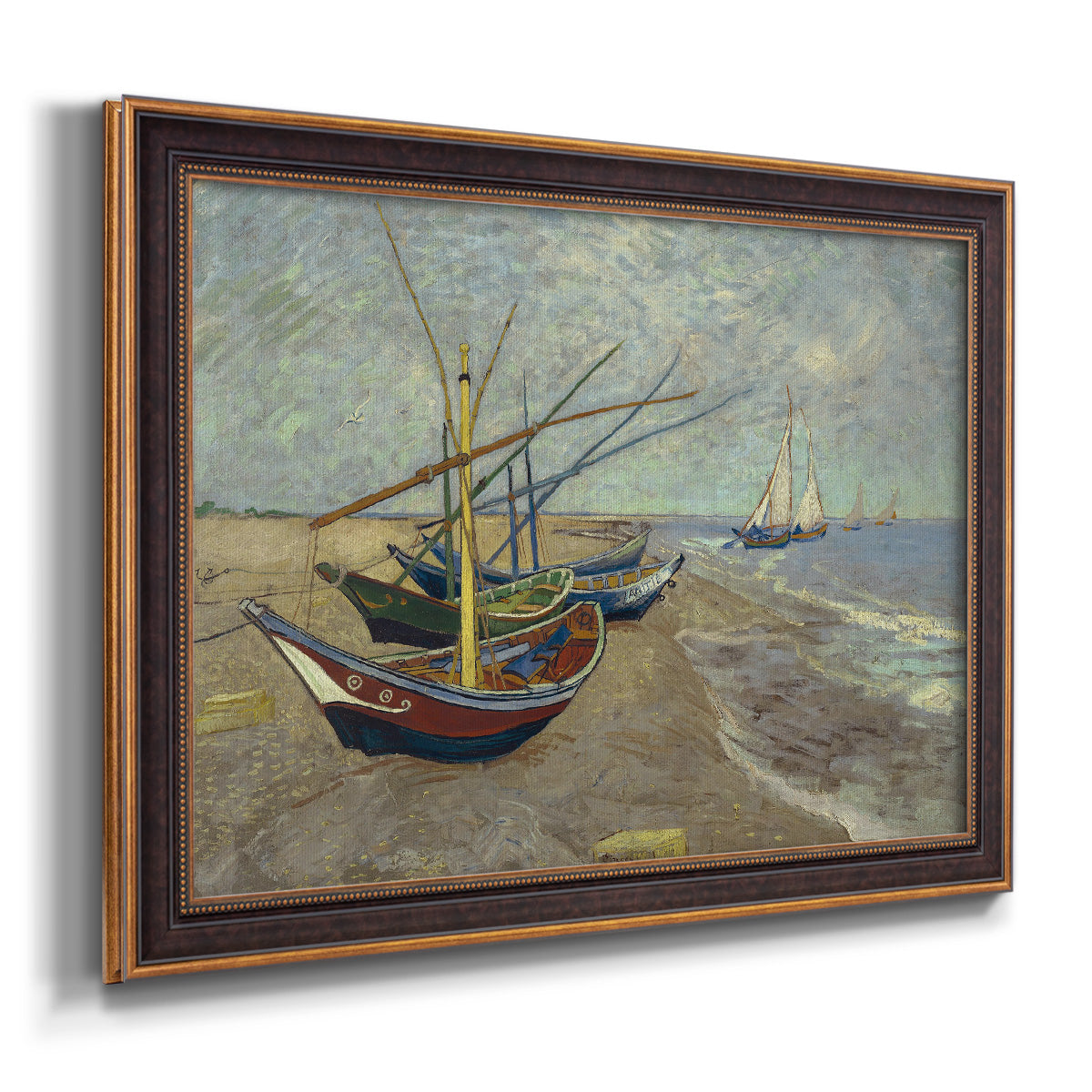 Impressionist coastal fishing boats scene by Vincent van Gogh printed on canvas in an ornate bronzed mahogany wood frame.