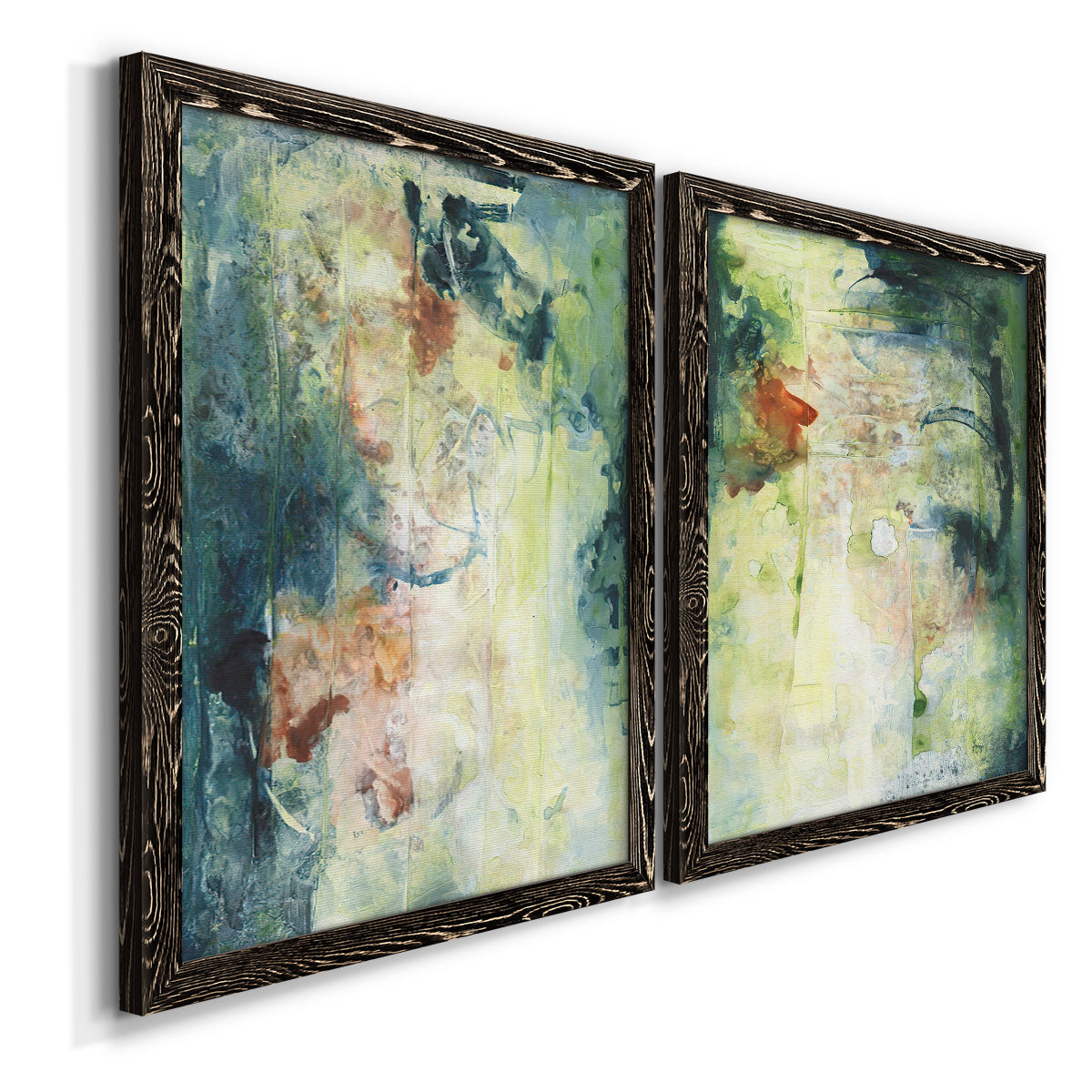 Angled view of a set of two black barnwood framed canvas prints featuring two nature-inspired mixed-media abstracts featuring layered blue green cream and charcoal textures.