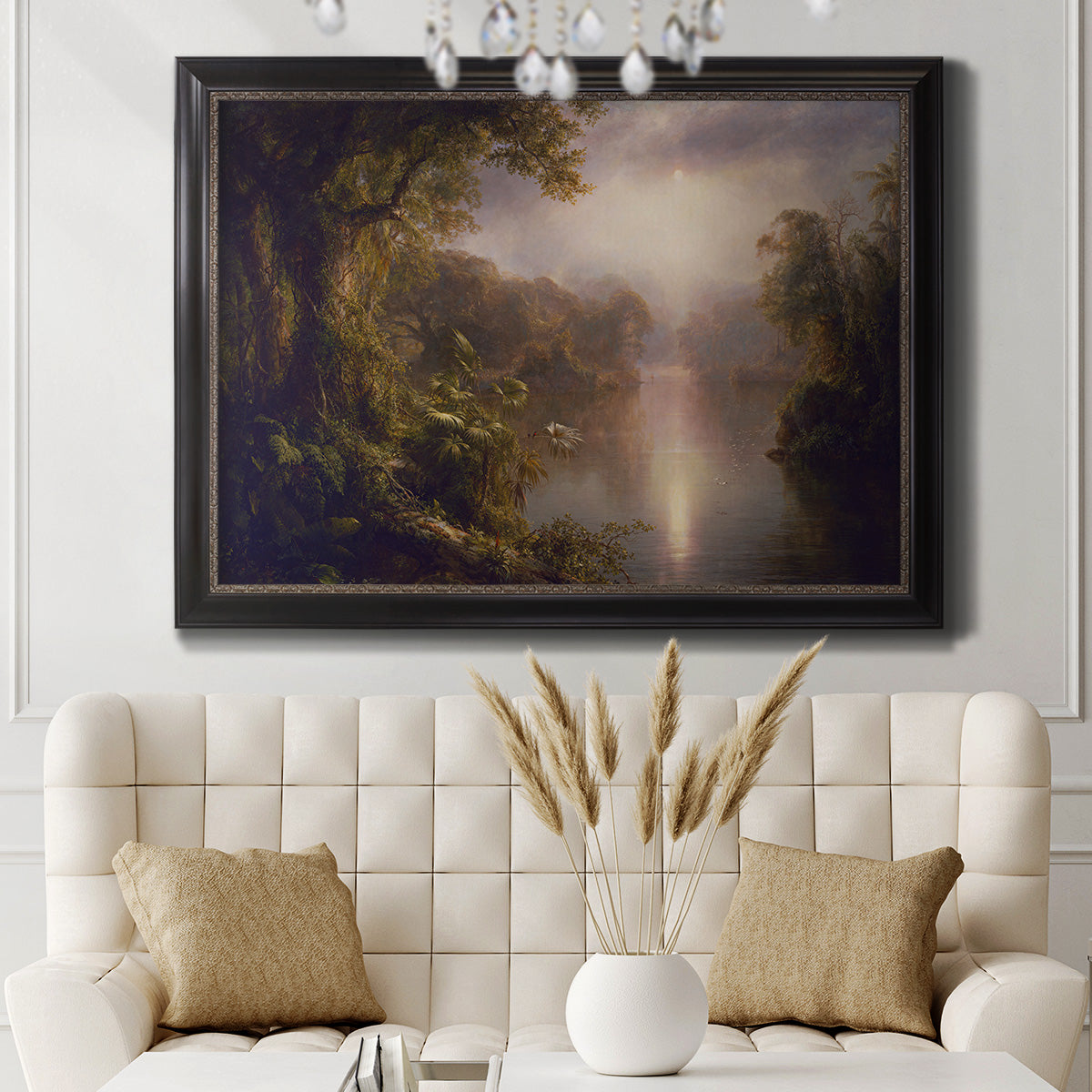 Luminous romantic landscape painting by Frederic Edwin Church in an ornate black frame with gilded inner detail displayed in a neutral-toned interior setting.