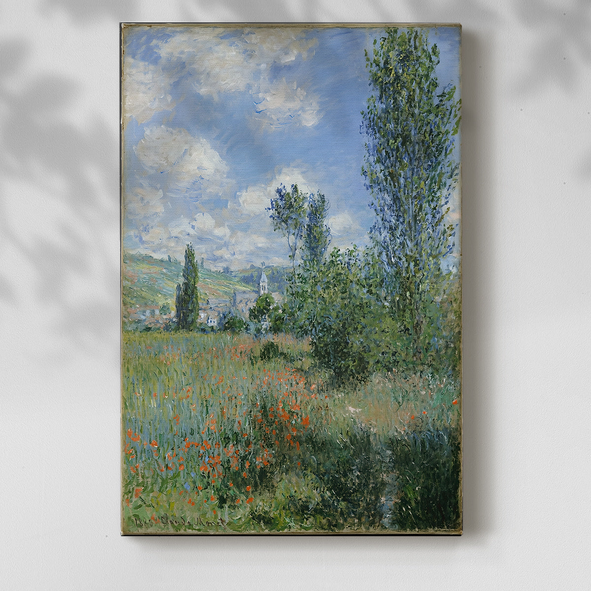 Canvas art print of a riverside village scene with gentle brushwork and greenery with a soft shadow on a white background.