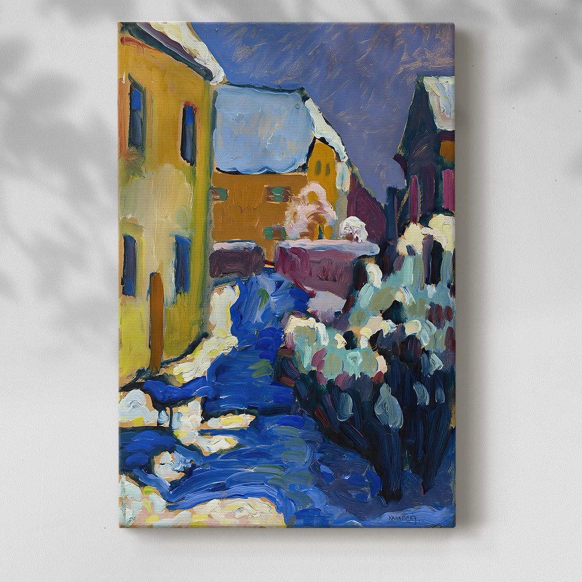 Canvas art print of a stylized village scene with simplified forms and vivid tones with a soft shadow on a white background.
