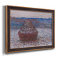 Impressionist single haystack landscape by Claude Monet printed on canvas in an ornate bronzed mahogany wood frame.